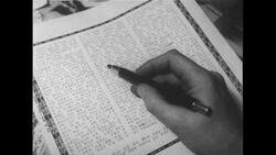 United States, 1950s: Hand edits photos Stock Footage