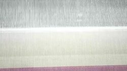 Colorful Threads on a loom in  weaving loom machine in textile factory Stock Footage