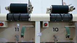 White yarn spools of industrial warping machine in textile factory Stock Footage