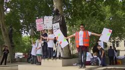 Children and their families hold placards during protest over funding crisis in education for young people with special educational needs and disabilities News Clip