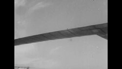 Demonstration of USAF Hughes jet helicopter XH-17 lifting truck trailer in Culver city, CA News Clip