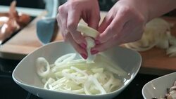 Woman preparing onion Stock Footage
