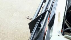 Dolly side of male car mechanic working under vehicle engine Stock Footage