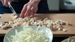 Woman cutting chicken meat Stock Footage