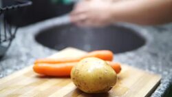 washing and cutting potatoes vegetables Stock Footage