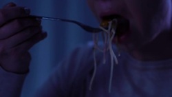 Portrait of sorrowful crying female eating spaghetti alone, psychological trauma Stock Footage