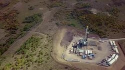 Aerial View of a Fracking Drilling Rig in the Autumn Mountains of Colorado Stock Footage