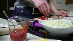 Young woman preparing pizza Stock Footage