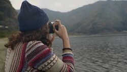 Woman taking pictures of the Mt.Fuji with camera Stock Footage