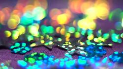 Silver glisten stars moving down. Abstract shiny background with bokeh. Christmas or holiday theme. HD Stock Footage