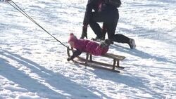 CLEAN : Munich locals enjoy the snow as Europe's cold wave continues News Clip