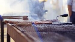 Cooking Kebabce. Balkan meatball barbeque on grill at local traditional festival Stock Footage
