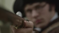 Young Revolutionary War soldier looking down barrel of musket Stock Footage