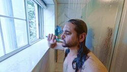 Mature 45-years-old man brushing teeth under the shower in the domestic bathroom. Stock Footage