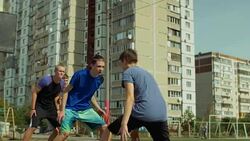 Streetball guard stealing a ball during outdoor game Stock Footage