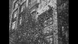 United States, 1950s: Ticker tape falls from building in New York City parade Stock Footage