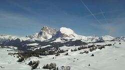 Flying on Seiser Alm with Langkofel mountain in background Stock Footage