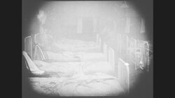 1910s: Schoolgirl saves an unconscious girl from burning building Stock Footage