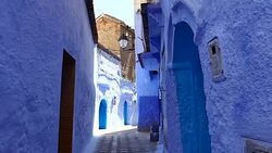 Tilt: Narrow Walkway Between Buildings Stock Footage