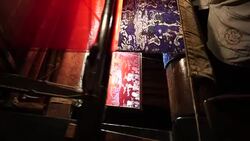 Craftsman working on huge old wooden brocade weaving looms Stock Footage