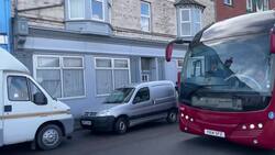 Coach carrying asylum seekers for Bibby Stockholm arrives at Portland Port News Clip