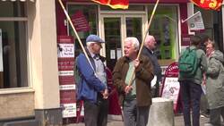 Demonstrators gather outside the Reform UK office in Hamilton News Clip