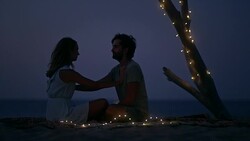 Spiritual bond. Couple meditating at the beach Stock Footage
