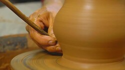 Potter works with clay Stock Footage