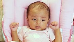 Newborn baby playing Stock Footage