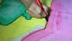 Female hands mark the outline of sketch or pattern with a black marker. Stock Footage