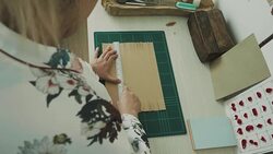 Woman artist is cutting paper Stock Footage