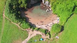 Drone Flight Over Gulpiyuri Beach: Spain’s Smallest Inland Beach Stock Footage