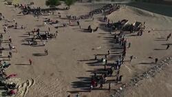 Migrants line up to cross the border into U.S. News Clip