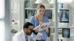 Multiethnic Colleagues Conducting Research in Laboratory Stock Footage