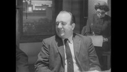 1960s: Man sits at table talks Stock Footage