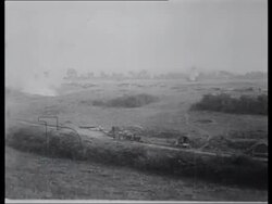 Artillery fire at horse-drawn carriages. Casualties on road. Stock Footage
