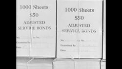 Workers prepare military bonus bond checks for distribution News Clip