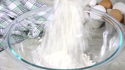 Pouring baking mix into a mixing bowl Stock Footage