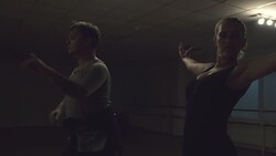 Man and a woman are dancing in the studio Stock Footage