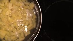 A chef in a professional kitchen cooking mashed potatoes in metal pan on rustic table background in the kitchen. Concept diet, food, Italian and nutrition. Stock Footage