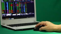 Using laptop trading stock exchange Stock Footage