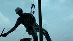 Silhouette of worker washing and cleaning the window. Stock Footage
