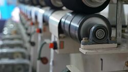 White yarn spools of industrial  warping machine  in textile factory Stock Footage