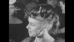 Models demonstrate autumn hat fashions in a bar setting in Paris, France News Clip