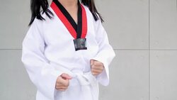 Day in the Life of a Child : Little asian child in fighting action,Asian girl practice taekwondo,Asian taekwondo girl Stock Footage