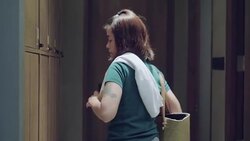 Young woman puts the bag in a locker storage in Gym Stock Footage