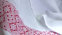 National red and white embroidery. The process of decorating decorative towels embroidered red ornament. Stock Footage