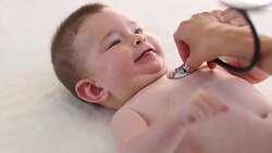 Little baby boy is examined by a doctor. Stock Footage