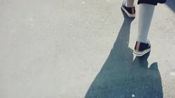 Female in shoes and skirt going in the city centre Stock Footage