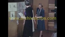 Women check fit of dress on model, c.1940 Stock Footage